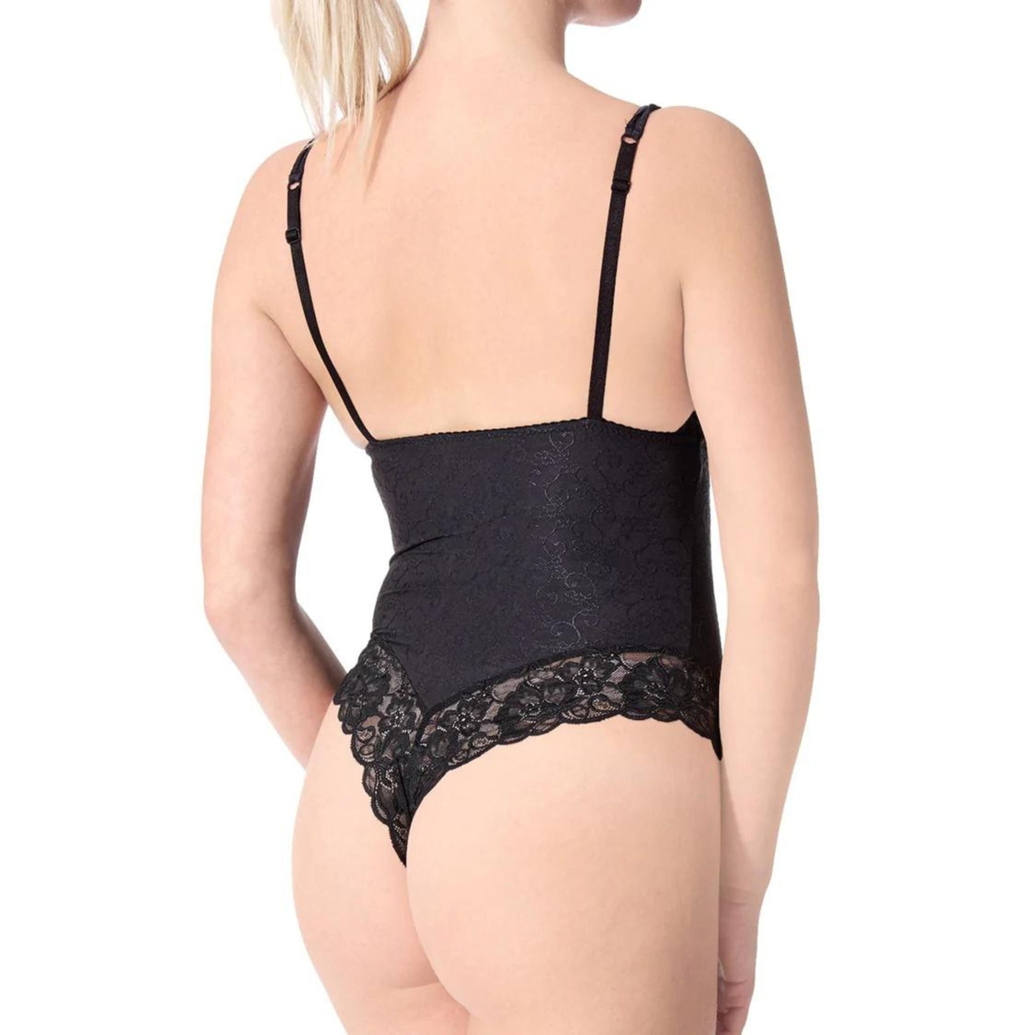 Let yourself be seduces by this simply elegant lace bodysuit. Featuring a v neckline, adjustable shoulder straps, lace cups, a cheeky thong cut and a snap closure cotton gusset. Top and edges made in a delicate floral lace. Body made in a smooth, stretch micro nylon jacquard. Fabric: 87% Nylon 13% Elastane Machine wash. Delicate cycle. Hang to dry. Made in Canada