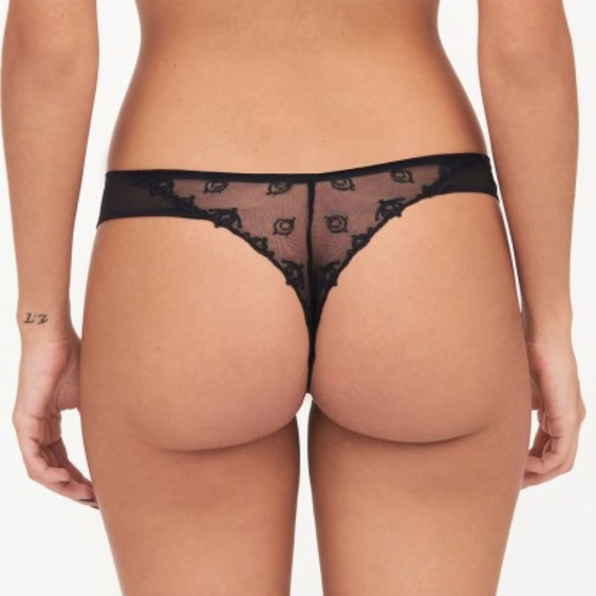 The Champs Elysse Lace Thong is modern and sexy with the sleek pairing of embroidery and mesh. Minimal back coverage provides a seductive twist to this everyday style. Sheer lightweight embroidery and mesh Low-rise everyday style Lace leg openings stay put without digging in Designed in France