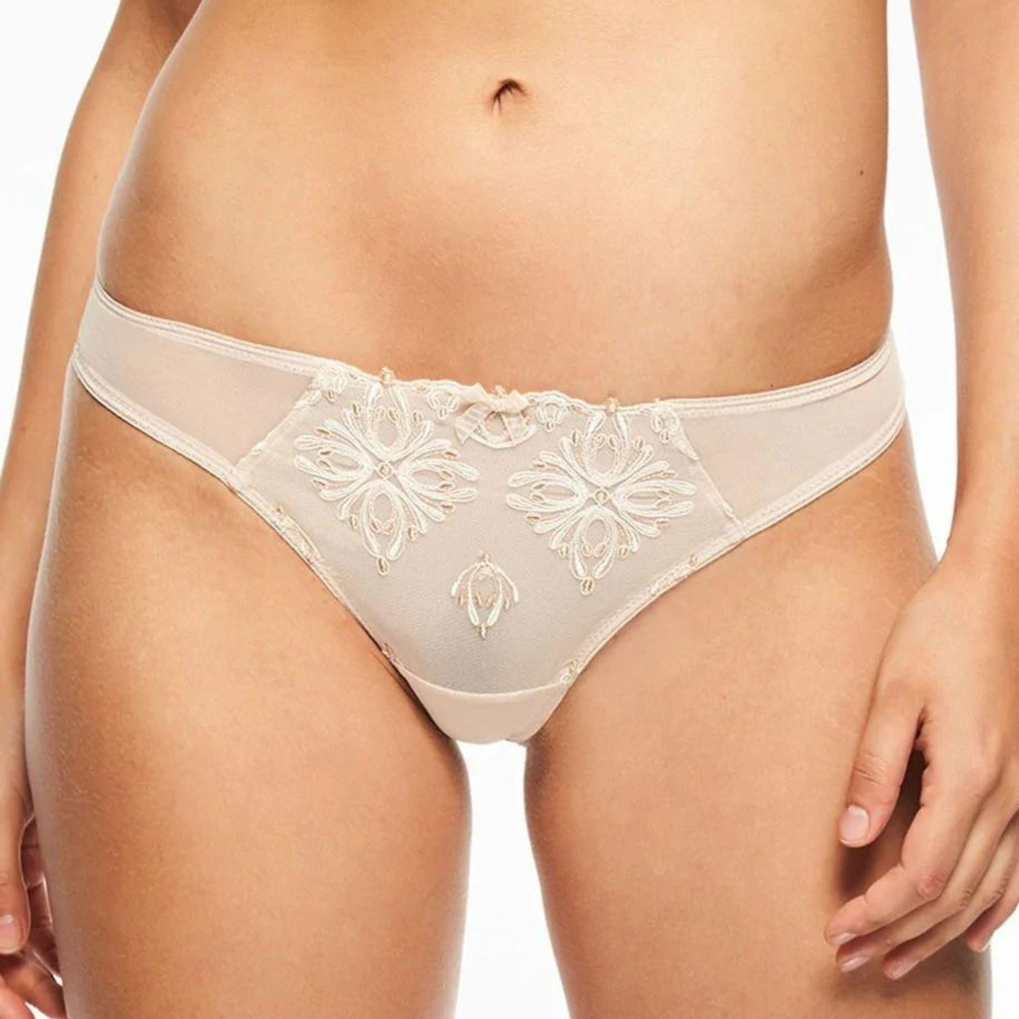 The Champs Elysse Lace Thong is modern and sexy with the sleek pairing of embroidery and mesh. Minimal back coverage provides a seductive twist to this everyday style. Sheer lightweight embroidery and mesh Low-rise everyday style Lace leg openings stay put without digging in Designed in France