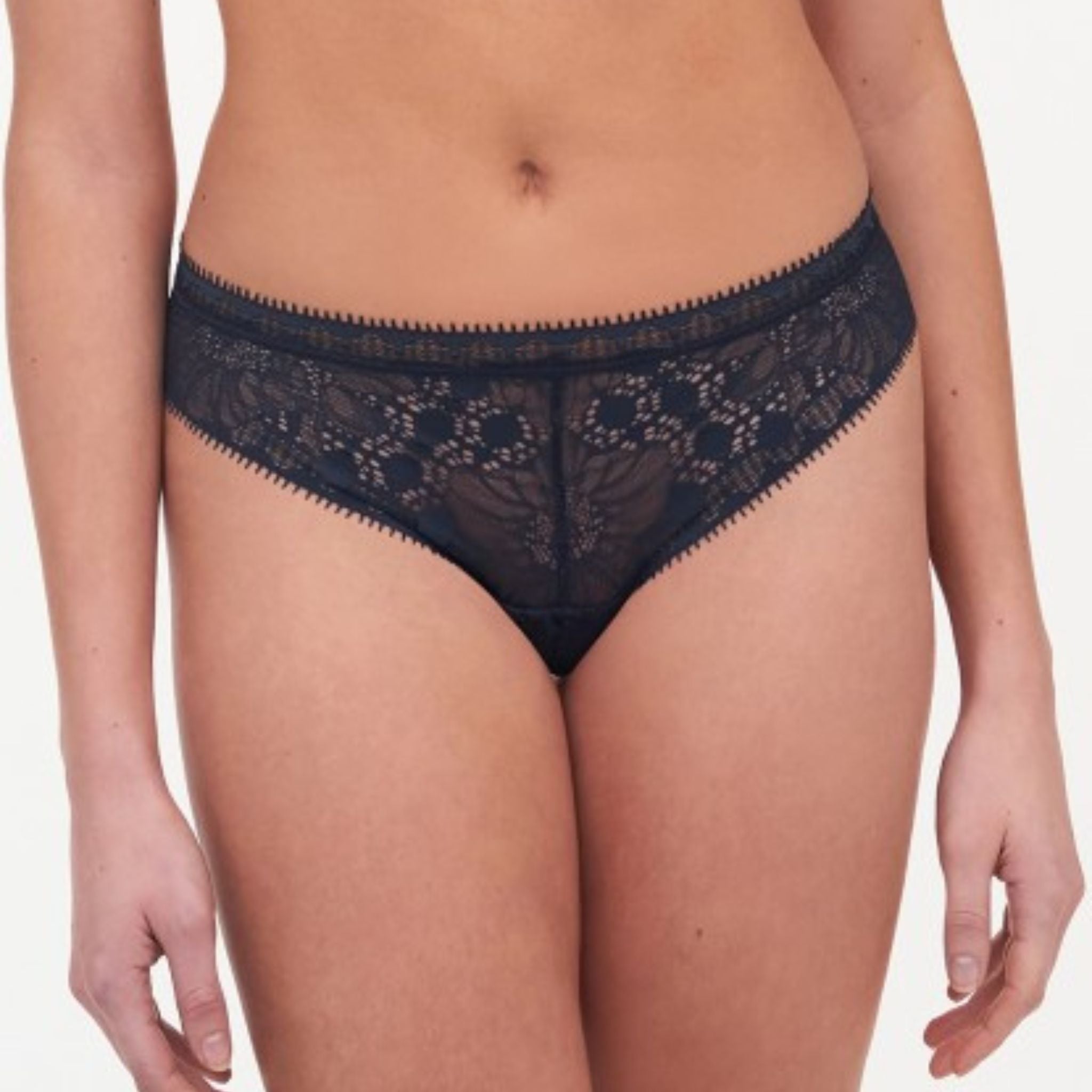 All day elegance, detailed lace and ultimate comfort make the Day to Night Tanga a must-have in every lingerie wardrobe. Soft and refined mesh lined lace front for a comfortable feel Soft elastic around the waist Classic tanga shape Designed in France