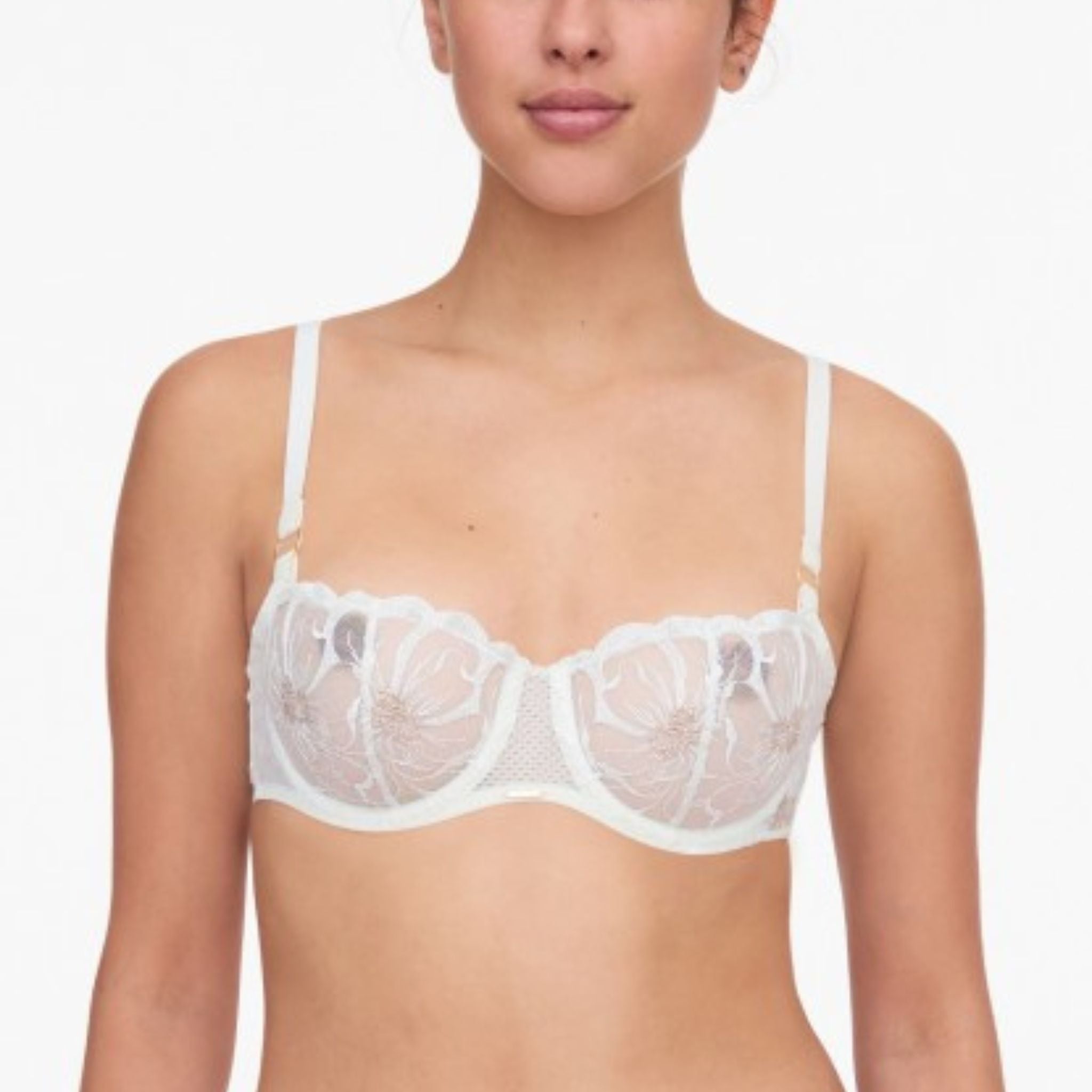 With lush floral embroidery through the cups that are transparent and seductive, the Fleur Demi embodies softness and femininity. Open yet contained demi neckline with soft vertical seam for uplift and top swell effect Centerfront and back lined with fishnet that subtly reveals the skin while offering additional support Detailed, fully adjustable straps with gold rings at front Leotard or “U” Shaped back for support, comfort, and to help anchor straps Cushioned hook and eye Designed in France