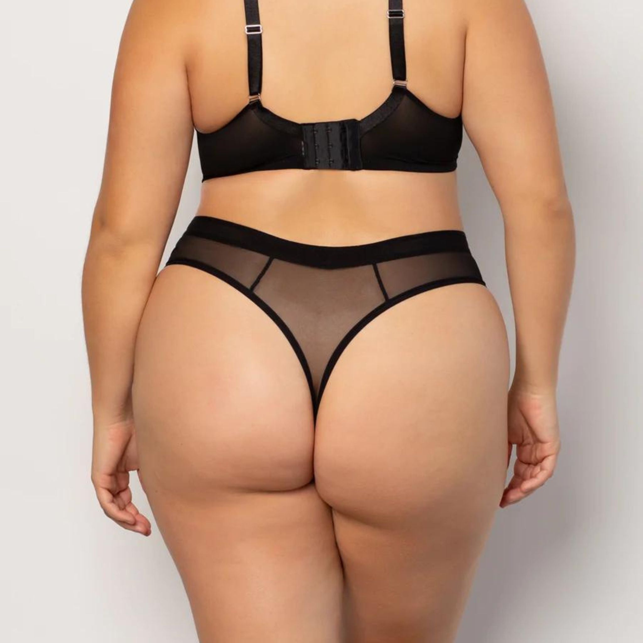 Curvy Couture's best-selling mesh collection now offers a thong. The stretch mesh thong is effortlessly sexy with ultimate comfort. A top drawer essential and perfect under any outfit. · High cut leg opening · Sleek and soft with breathable, airy mesh fabric · Medium rise sits below the belly button · Ultra-breathable with sheer mesh stretch fabric · Panties have a cotton lined gusset for comfort · No VPL! Invisible panty lines, every time