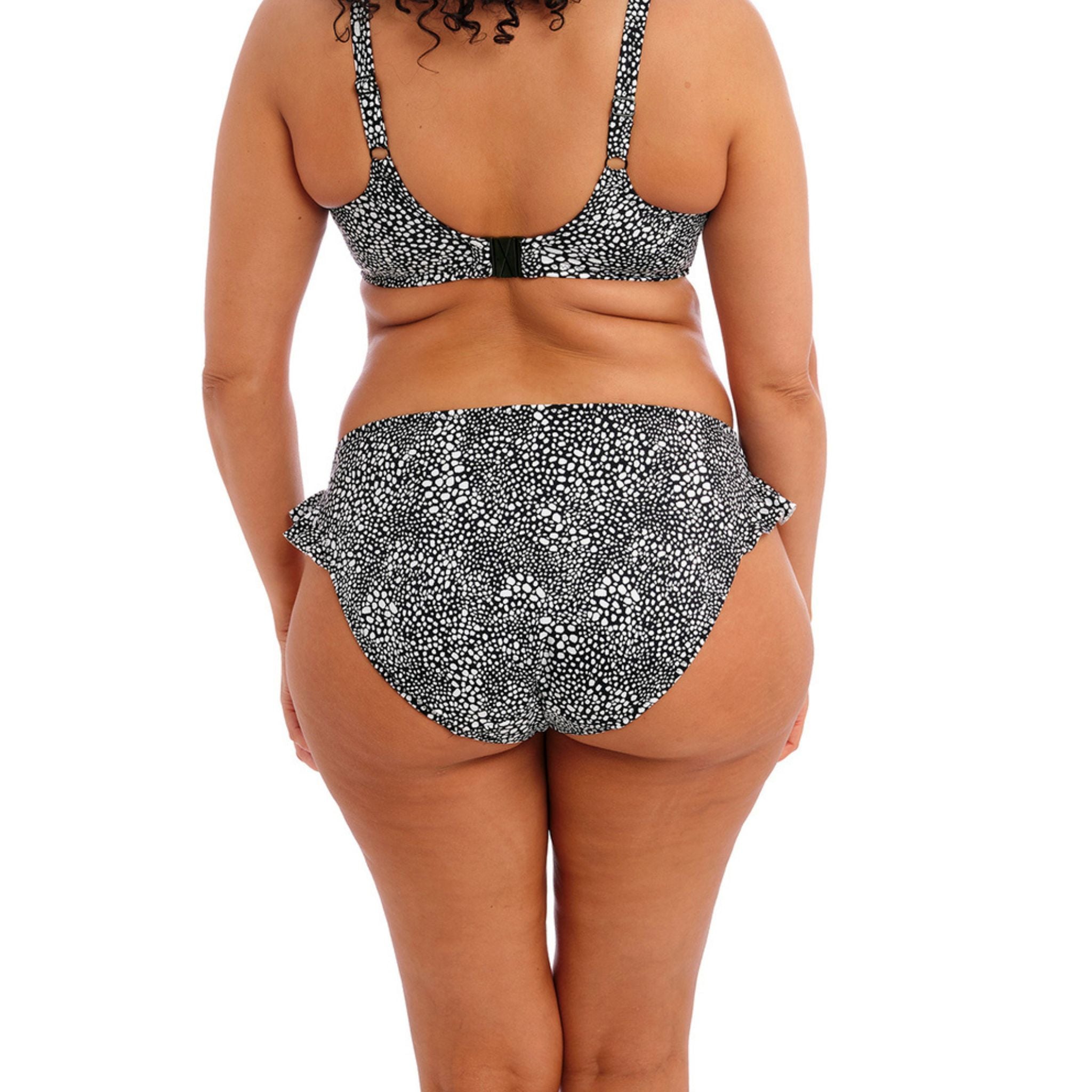 With a flattering frill detail at the side of the leg, Elomi's Pebble Cove High Leg Brief in Black would be an oh-so-pretty addition to your swimwear collection. Featuring a monochrome abstract spot design, cut from a lightweight LYCRA® XTRA LIFE™ fabric.