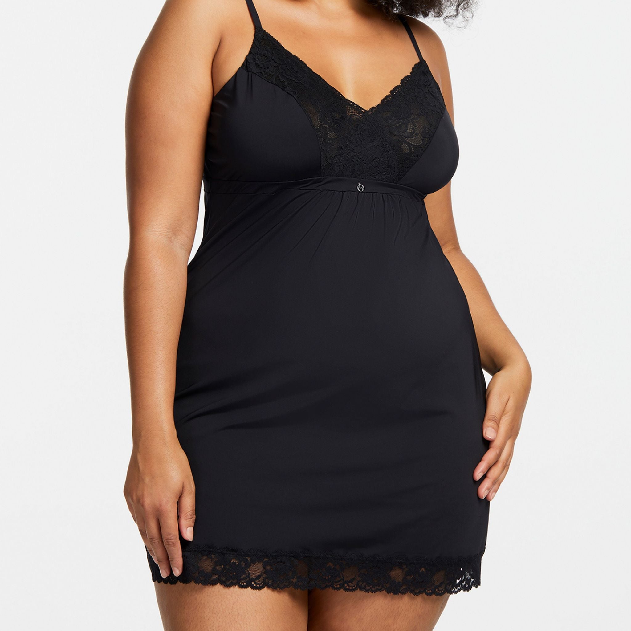 Nighty-night! This flattering A-line chemise in ultra-soft fabric has a secret - it is as strong as it is beautiful. The smooth stretch floral lace along the neckline is lined with mesh for support and the microfiber bust is double lined to enhance your natural shape.