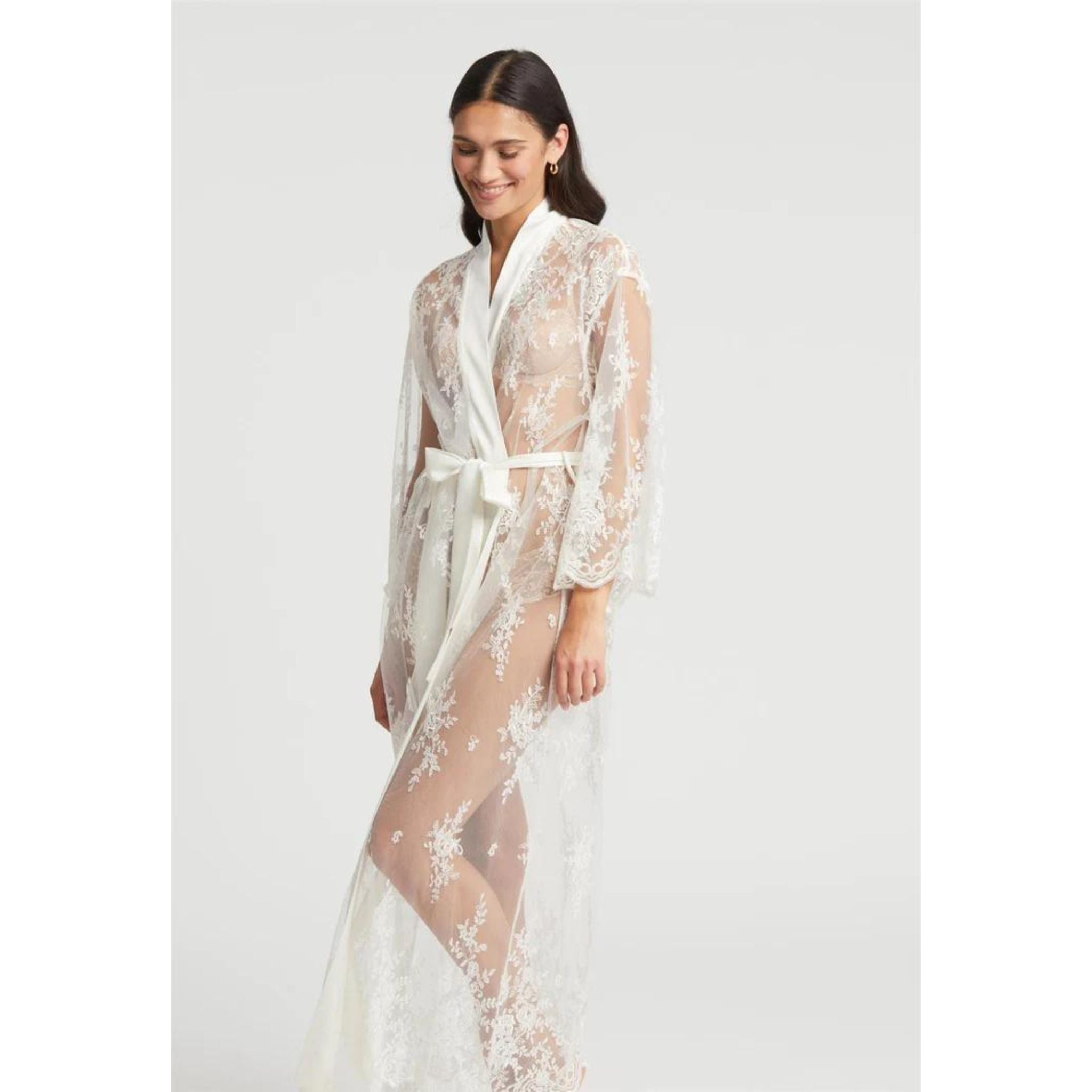 Montelle's signature, classic lace on a modern silhouette. Pair it with our Darling Gown or simply wear it out as a layering piece for a 'Beyond the Bedroom' moment. Details: Allover embroidered netting Poly charmeuse adjustable belt ties center front Ethically made