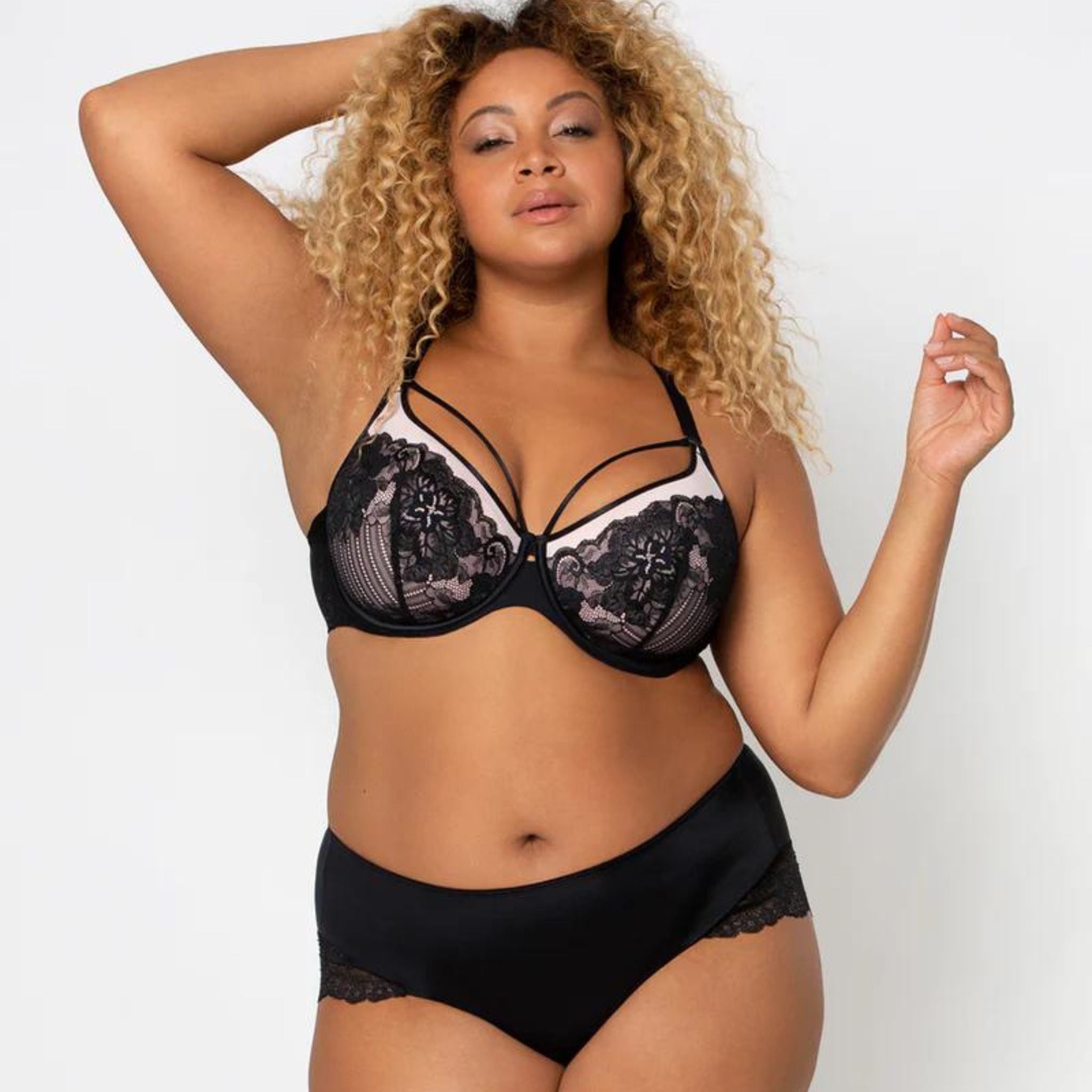 The Tulip Strappy Lace Push Up is a new take on Curvy Couture's best-selling plus size bra. The same support & lift you love in this stunning, one of a kind style. Beautiful sheer neckline with scallop lace overlay Cage Strap accents for a hint of sexy Graduated soft push-up pads give you a natural lift Luxe power mesh wings offer back-smoothing and breathability Fully adjustable Convertible back straps, wear cross-back or classic