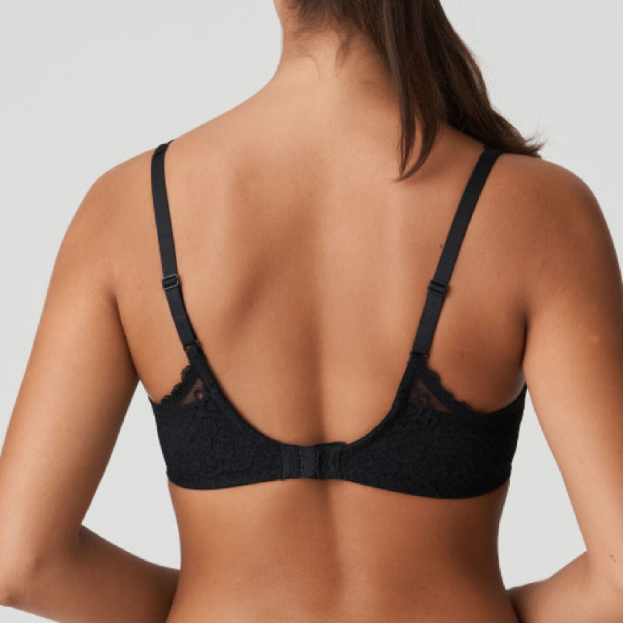 This three-piece underwire bra is feminine and comfortable. With oversized lace on the back and straps and a large satin bow on the front.