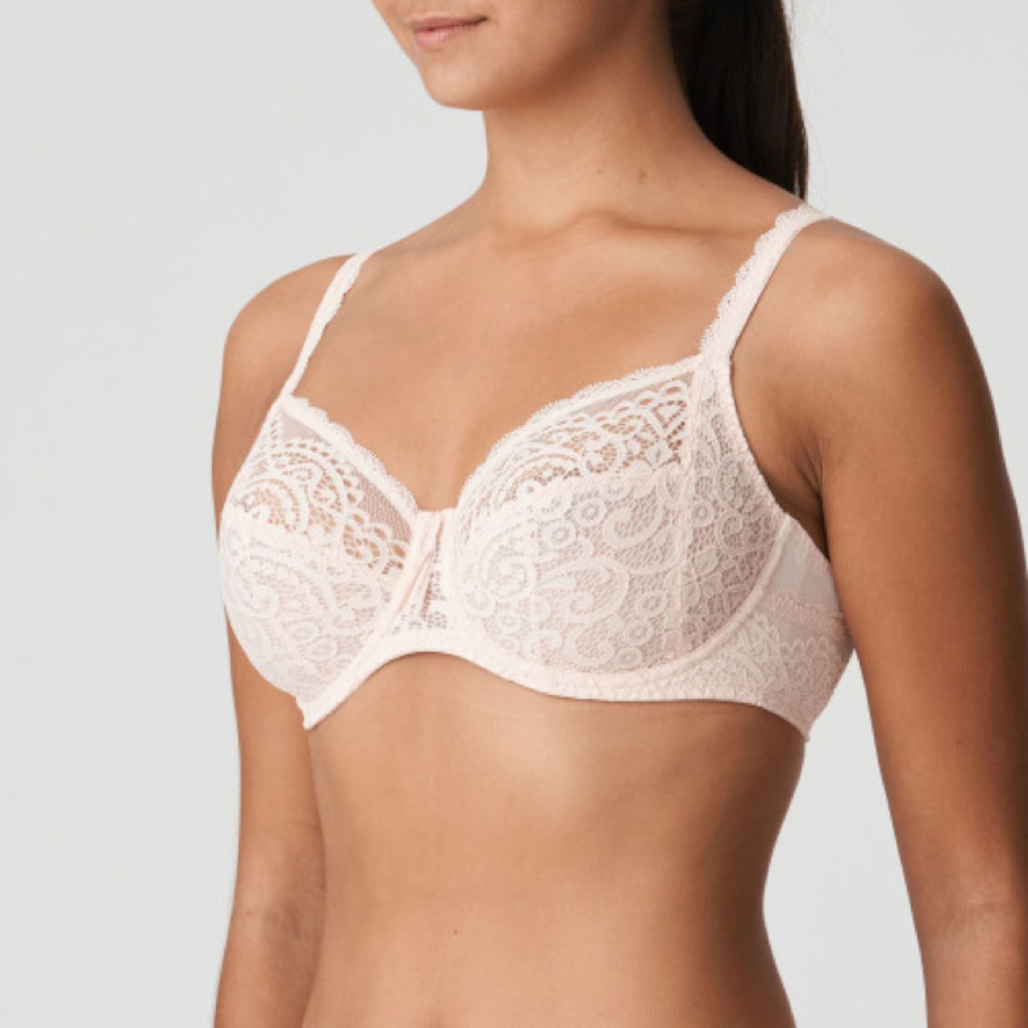 This three-piece underwire bra is feminine and comfortable. With oversized lace on the back and straps and a large satin bow on the front.