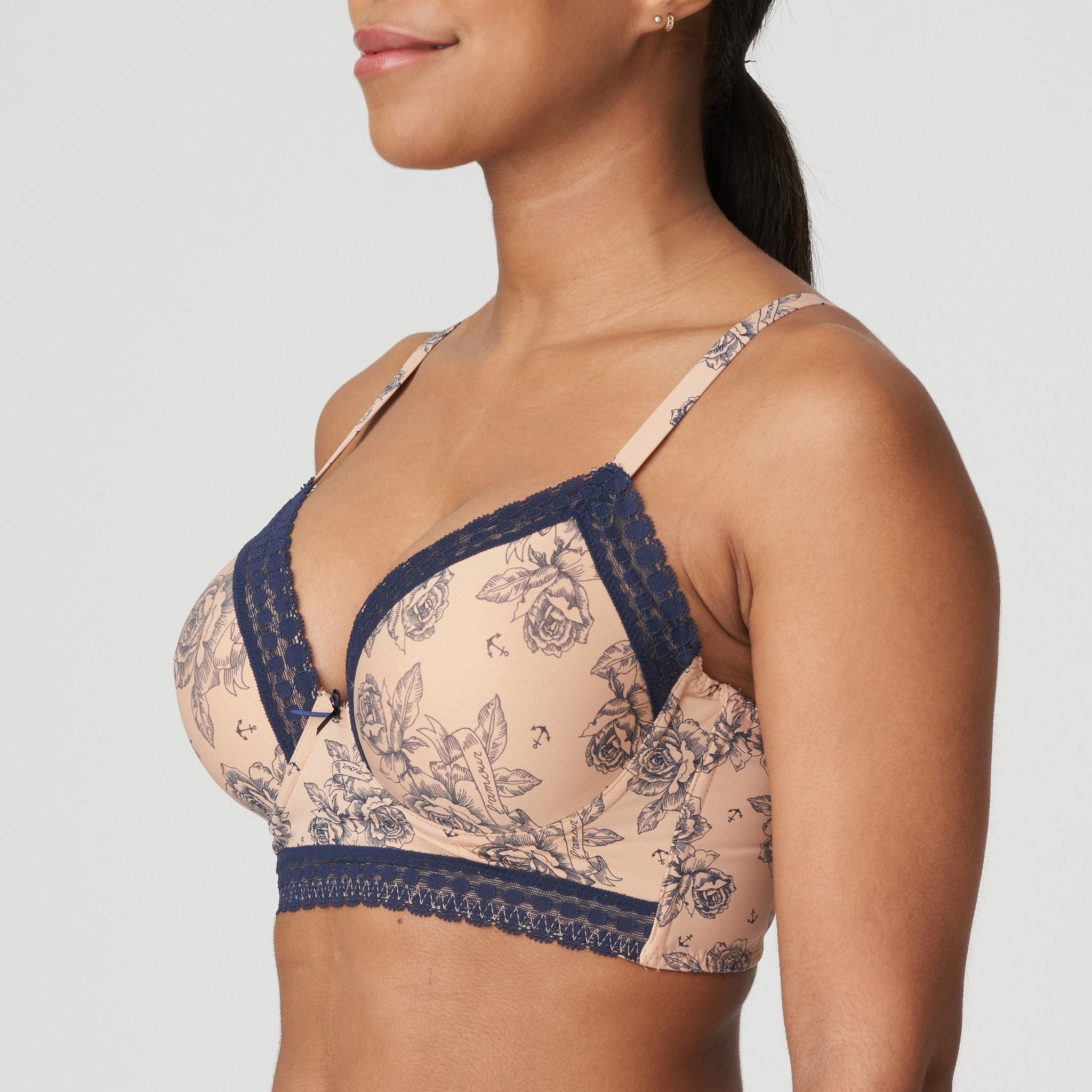 This longline bra is sexy and stylish: a retro cut with a plunging neckline, vintage lace on the upper cups and bottom, and a lovely fabric with a trendy allover tattoo print. Light Tan is a neutral pink with a cool tattoo print. Cool and feminine!