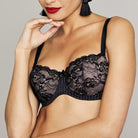 Feminine & seductive! The balconette bra with ¾ cups shapes a plunging, seductive cleavage which expertly highlights the sensuous lace look of the piece. The gorgeously shaped cups made of elasticated, tulle-lined lace have soft, yet firm foam padding for additional support and lift. The pin stripe print on the frame adds an exciting contrast. A cute little bow and decorative pendant on the bridge round off the look of this sensual and very luxurious lingerie. 