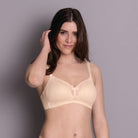 The Soft bra version of Eve is underwire-free and so incredibly comfortable that it will soon become your go-to piece. The patented DeltaPad moulded cups are decorated with delicate tulle – a combination that creates a breathtakingly lightweight, transparent look. This softie comes in cup sizes A-F and offers comfortable support and a great fit. A delicate little bow-tie on the bridge acts as an eye-catcher for the cleavage.