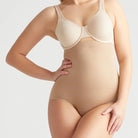 This high waist brief offers firm support and smooths your tummy with our Yummie Hug.  Level 4 firm shaping  Targeted waist shaping  Seamless styling gives you complete allover smoothing  Smooths and shapes comfortably everyday  Soft silicone at waist provides no-slip confidence  High-waist design sits just below the bra line