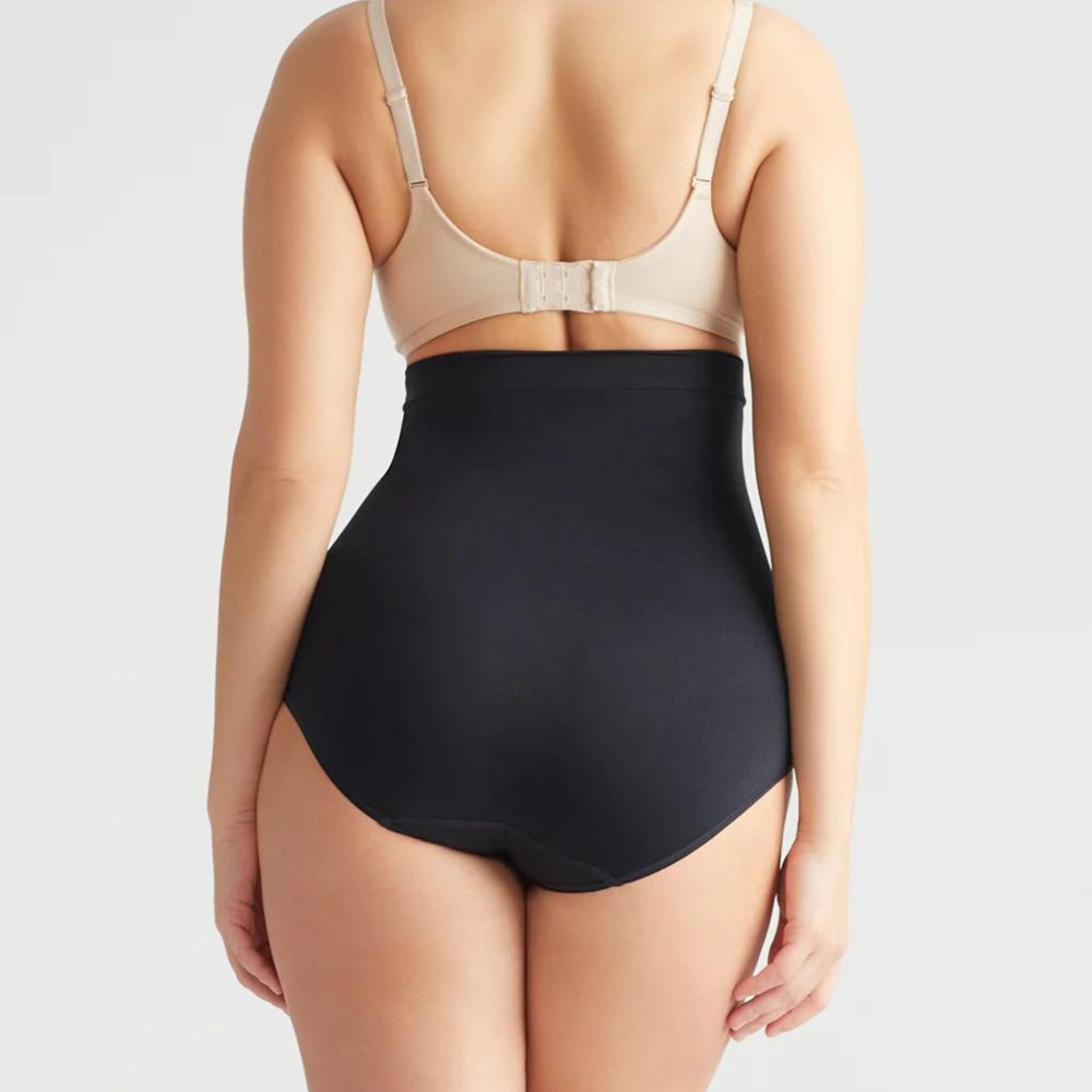 This high waist brief offers firm support and smooths your tummy with our Yummie Hug.  Level 4 firm shaping  Targeted waist shaping  Seamless styling gives you complete allover smoothing  Smooths and shapes comfortably everyday  Soft silicone at waist provides no-slip confidence  High-waist design sits just below the bra line